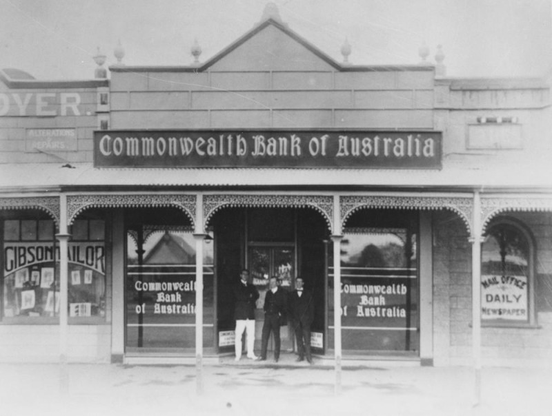 Three men standing on the verandah of the Commonwealth Bank of Australia. 