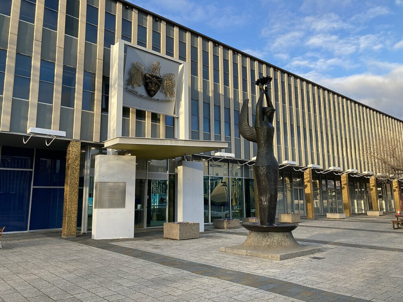 A statue outside the front of a building