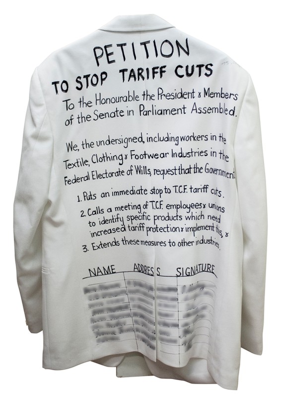 A petition on the back of a white dinner jacket requesting the Australian Parliament stop tariff cuts. 