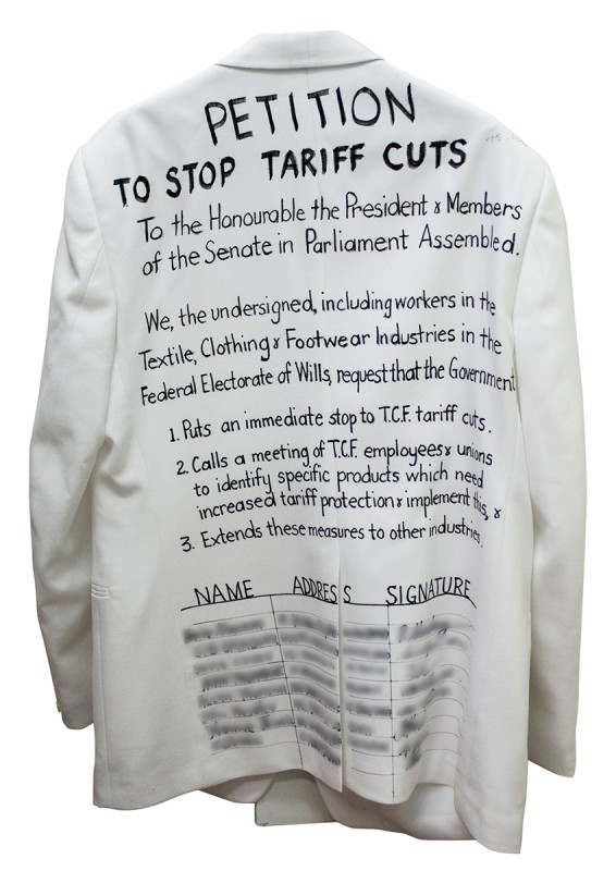 A petition written on the back of a white dinner jacket requesting the Australian Parliament stop tariff cuts. 