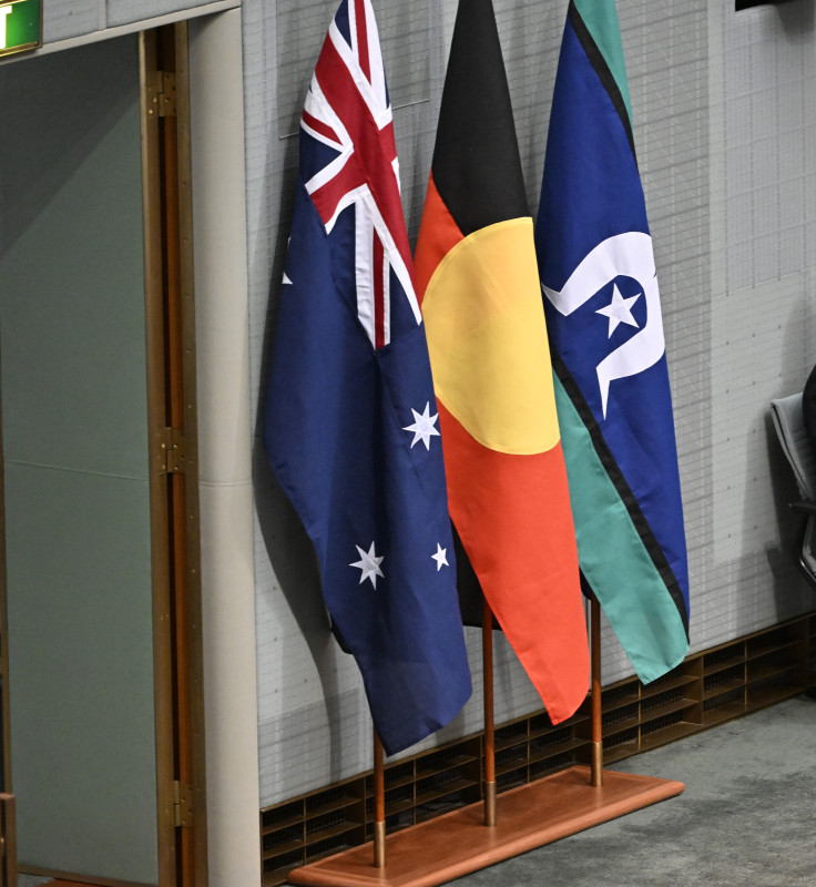 The Australian, Aboriginal and Torres Strait Islander flags displayed in the House of Representatives.