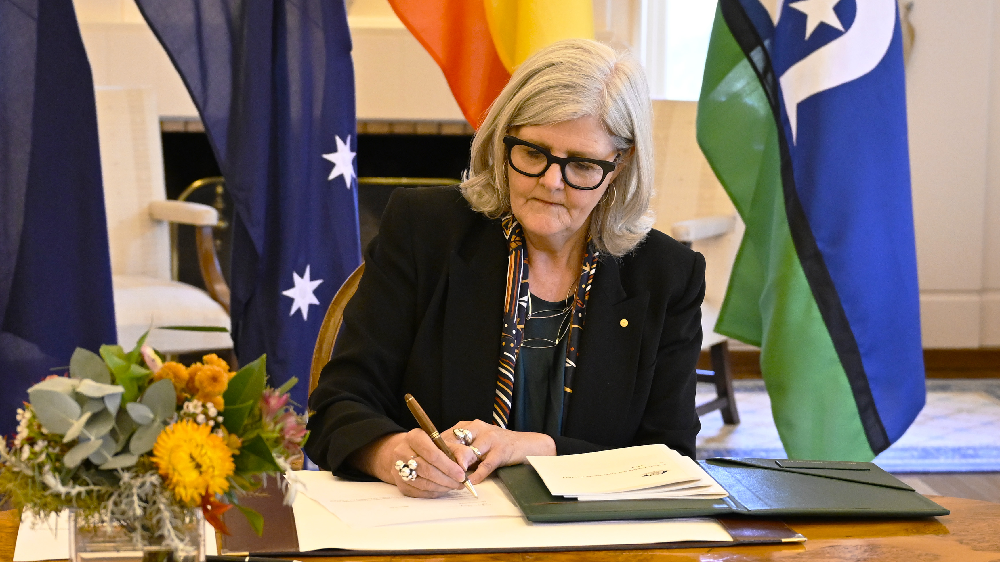 The Governor-General signing a bill.