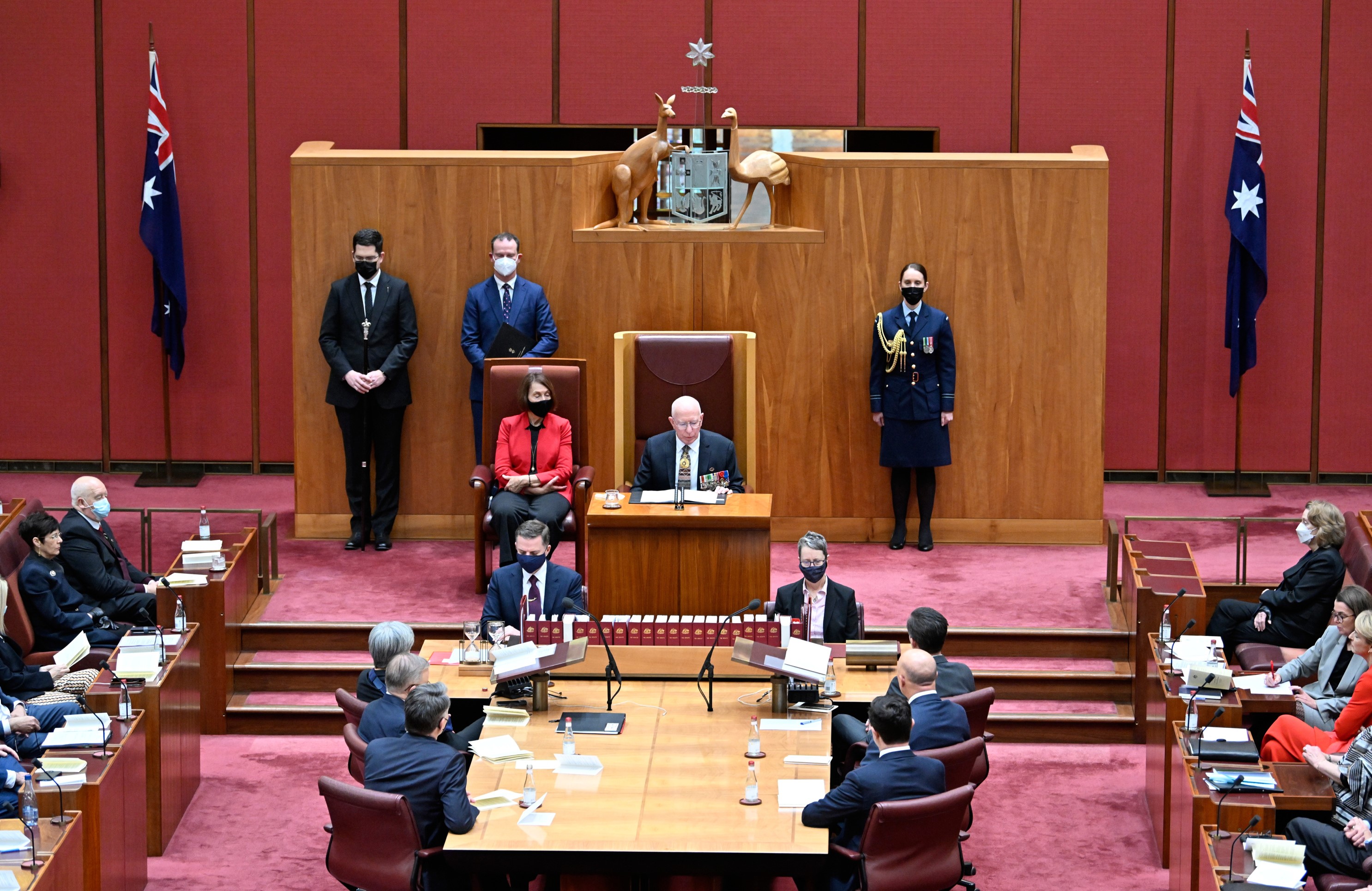 The Governor-General sits in the President of the Senate's chair in the Senate for the opening of Parliament.