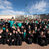 Slide 3: A group of students on a school trip in front of Australian Parliament House.